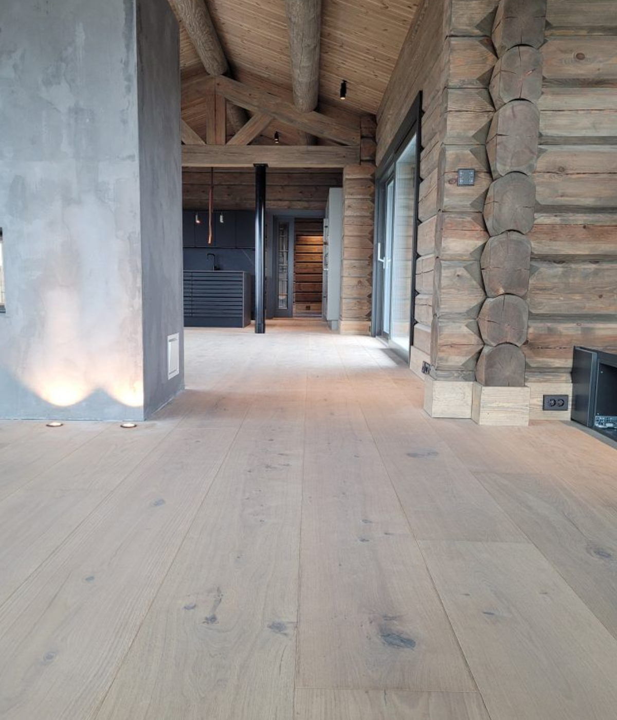 Designer London interior with matte oak flooring and contemporary furniture