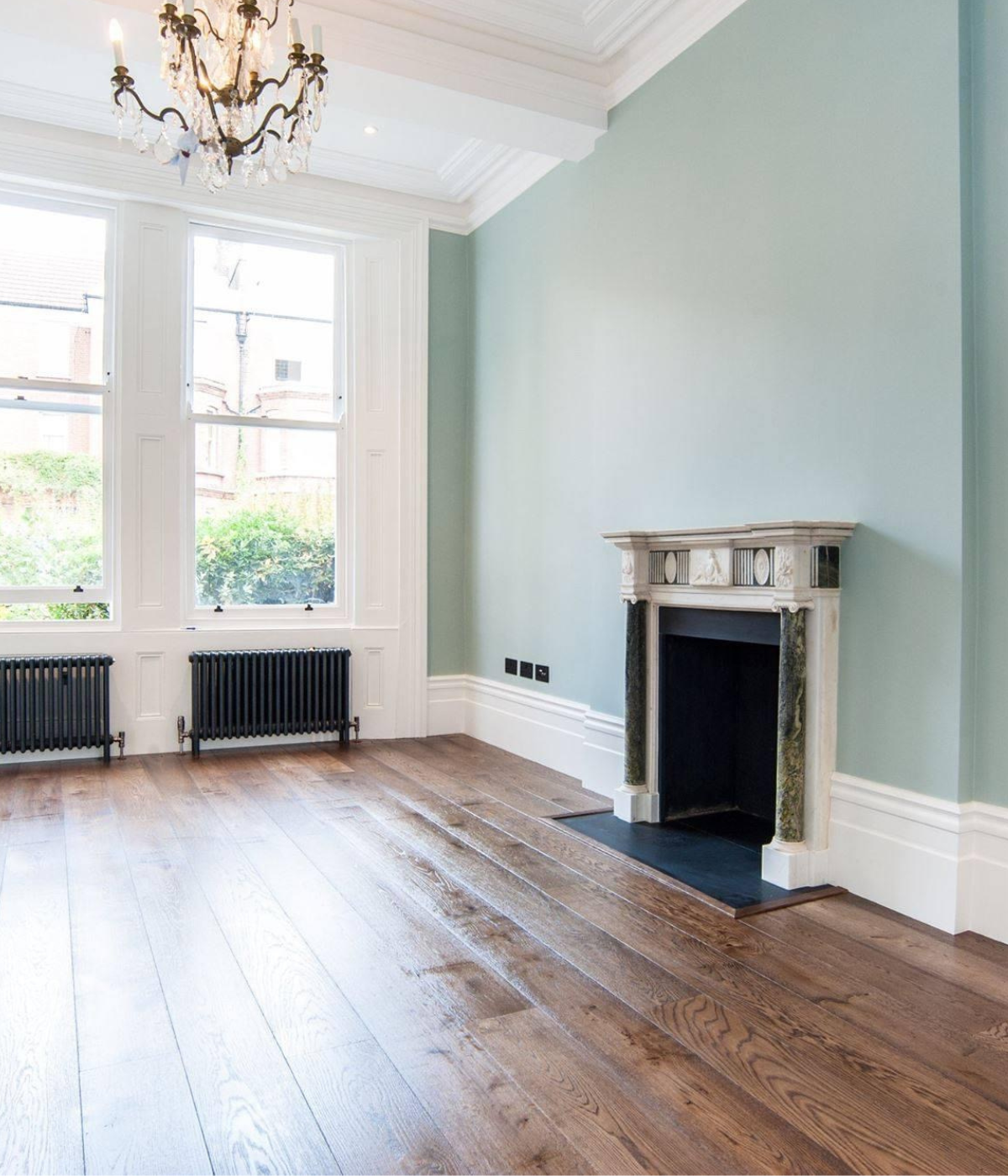 Natural oak wood floor complementing modern grey interior palette